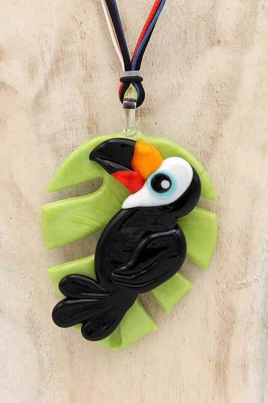 Black toucan on leaf pendant necklace