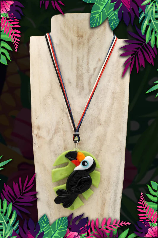 Black toucan on leaf pendant necklace